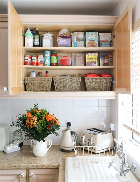 organizing dishes in kitchen cabinets